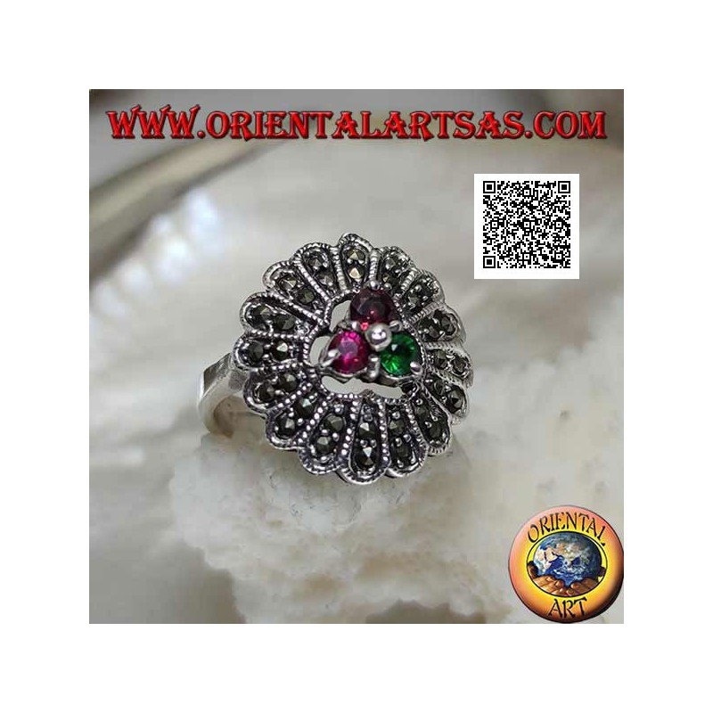 Silver flower ring with trio of central ruby and emerald colored zircons and long marcasite petals