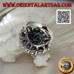 Silver ring in the shape of a large rose window with natural shuttle rubies and marcasite alternating in circles