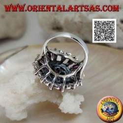 Silver ring in the shape of a large rose window with natural shuttle rubies and marcasite alternating in circles