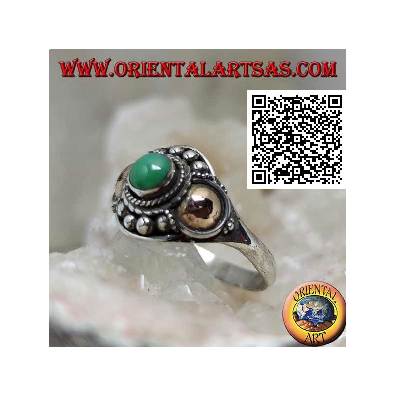 Silver ring with a jade sphere and gold plates on the sides