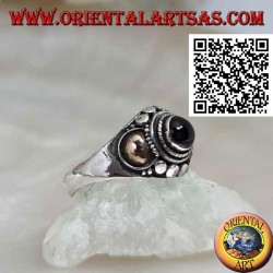 Silver ring with an onyx sphere and gold plates on the sides