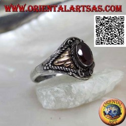Silver ring with oval garnet and triangular cords with gold plate