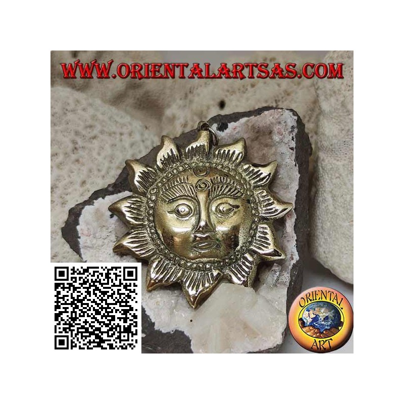 Nepalese pendant in the shape of a sun with a face in relief in brass