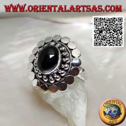 Silver ring with oval cabochon onyx surrounded by balls and discs