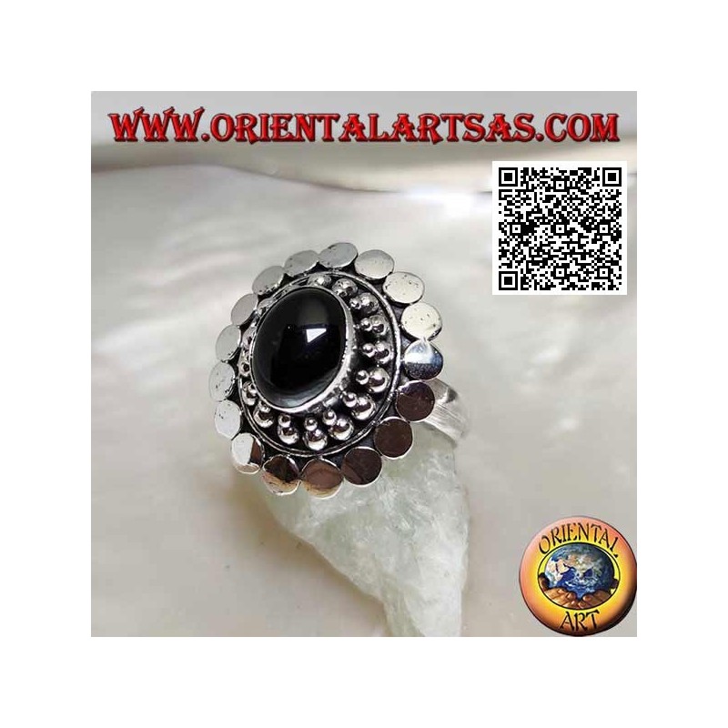 Silver ring with oval cabochon onyx surrounded by balls and discs