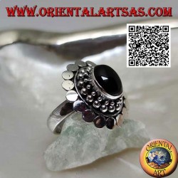Silver ring with oval cabochon onyx surrounded by balls and discs