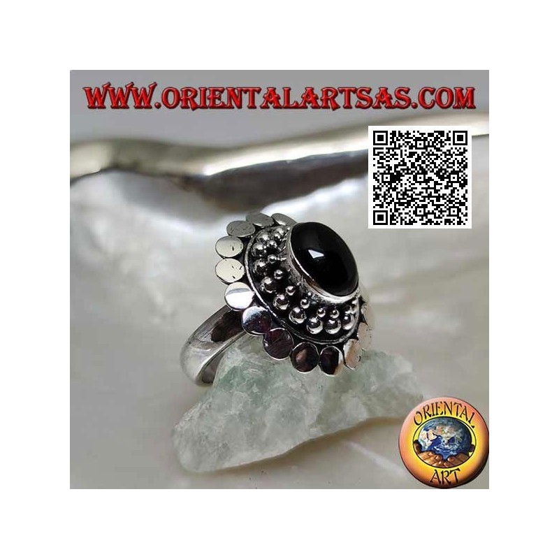 Silver ring with oval cabochon onyx surrounded by balls and discs