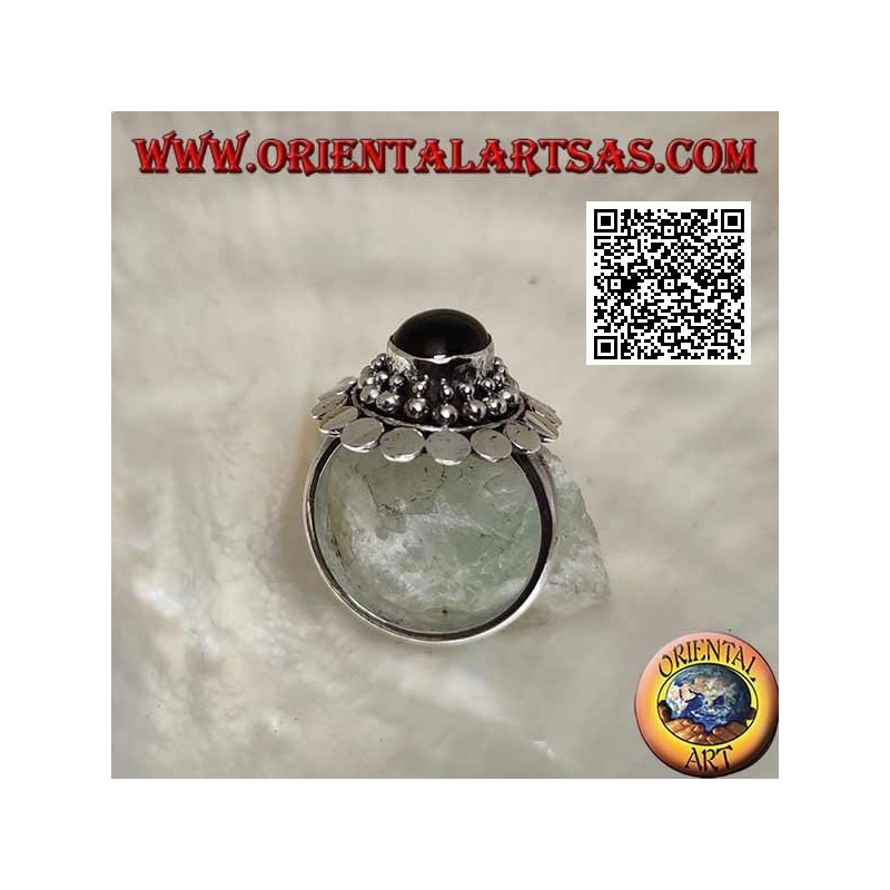 Silver ring with oval cabochon onyx surrounded by balls and discs