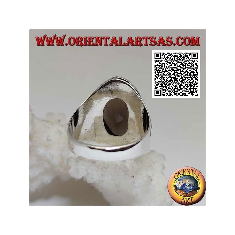 Silver ring with oval faceted smoky topaz surrounded by interweaving and hexagon of balls on the sides