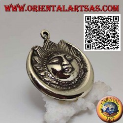 Nepalese pendant eclipse of sun and moon with face in relief in brass