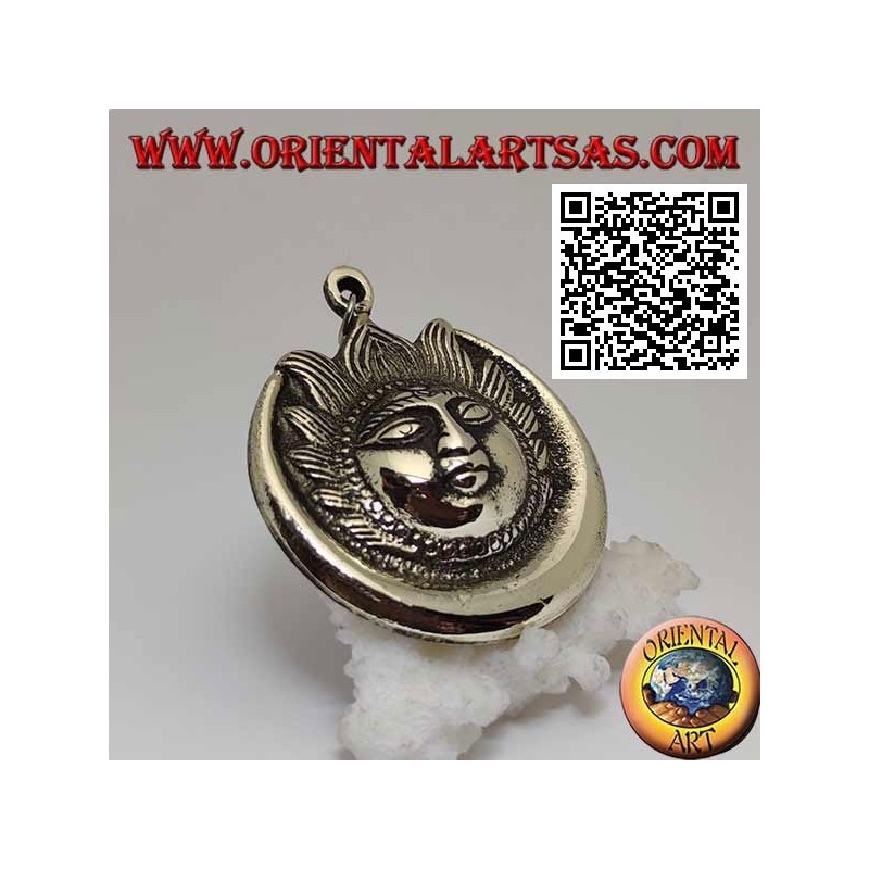 Nepalese pendant eclipse of sun and moon with face in relief in brass