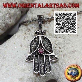 Silver pendant Hand of Fatima with perforated ethnic decoration and set ruby-colored zircon (oxidized)