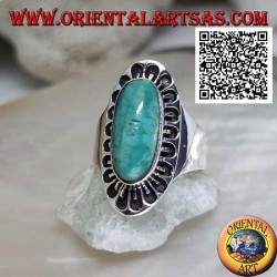 Silver ring with antique Tibetan turquoise elongated oval surrounded by engraved decoration