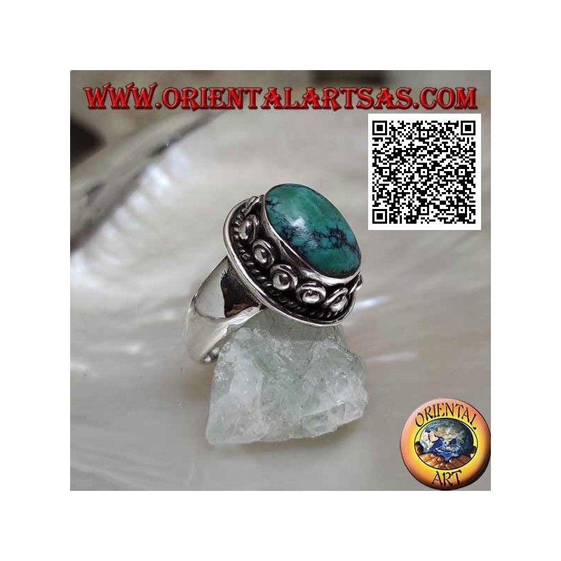 Anillo de plata con turquesa tibetana ovalada antigua rodeada de entretejido y bola en la rosquilla