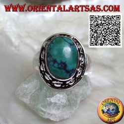 Bague en argent avec turquoise tibétaine ovale antique entourée d'entrelacs et boule dans le beignet