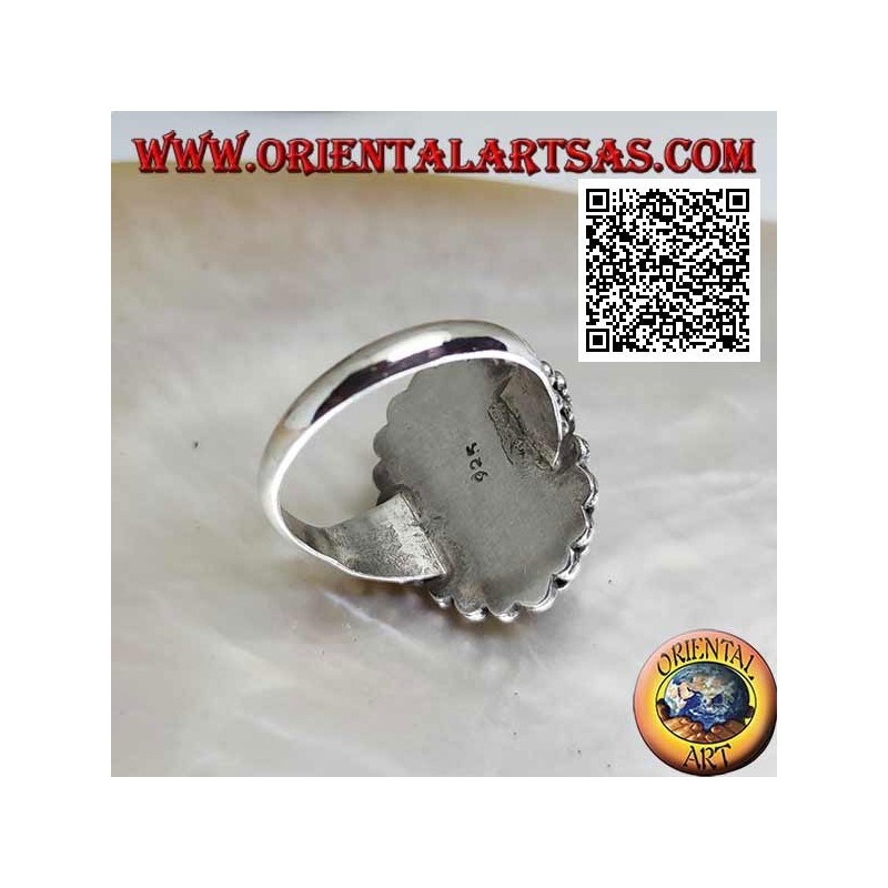 Anello in argento con onice ovale cabochon contornata da doppia fila di palline e palline sui lati