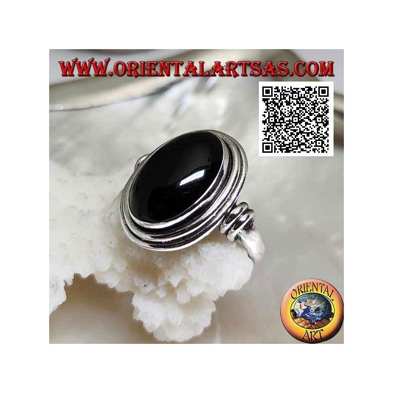 Silver ring with oval onyx surrounded by smooth discs at various levels