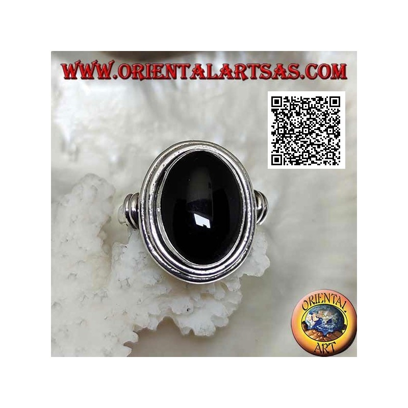 Silver ring with oval onyx surrounded by smooth discs at various levels