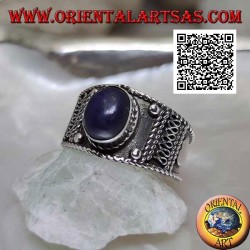 Silver band ring with oval cabochon lapis lazuli and ethnic decorations