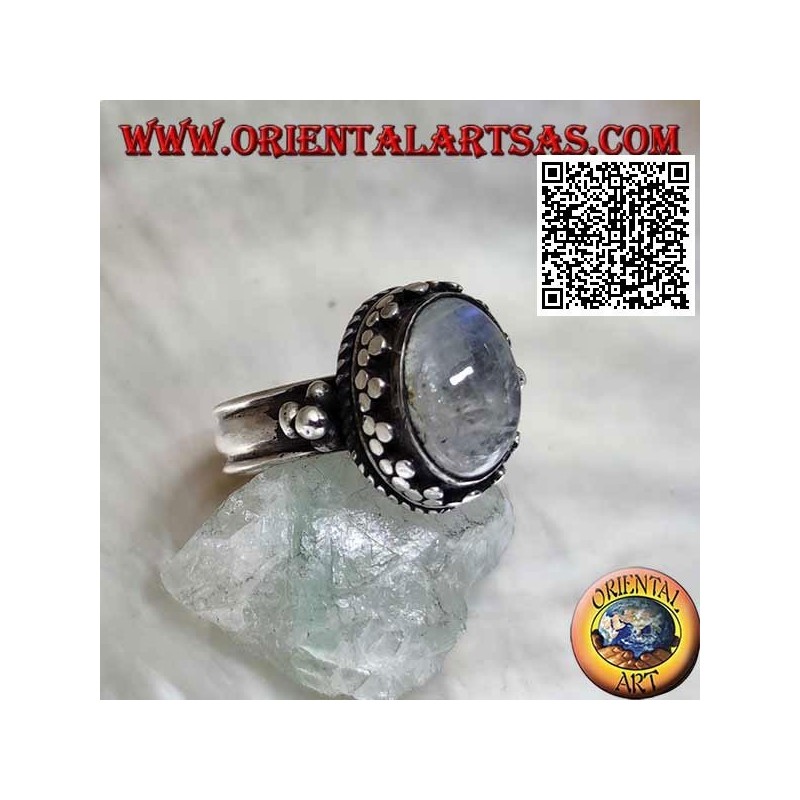 Silver ring with oval rainbow moonstone with tris rim and balls and intertwining