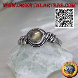 Silver ring with round labradorite in the center of a coiled wire