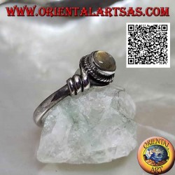 Silver ring with round labradorite in the center of a coiled wire