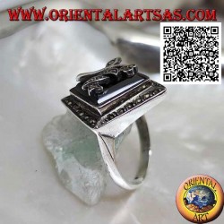 Silver ring with square rhomboid onyx with flower and frame studded with marcasite