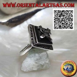 Silver ring with square rhomboid onyx with flower and frame studded with marcasite