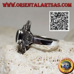 Silver ring with oval green agate surrounded by concentric decoration studded with marcasite