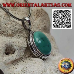 Silver pendant with antique turquoise cabochon oval surrounded by helical weave