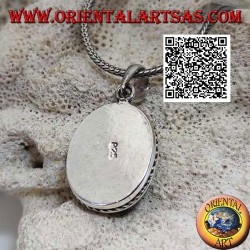 Pendentif en argent avec cabochon turquoise antique ovale entouré d'un tissage hélicoïdal