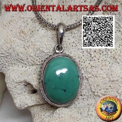 Pendentif en argent avec cabochon turquoise antique ovale entouré d'un tissage hélicoïdal