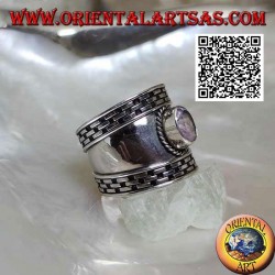 Wide band silver ring with oval faceted amethyst and hatching on the edges