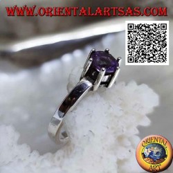 Solitaire style rhodium silver ring with faceted round amethyst set