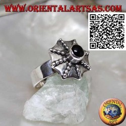 Silver ring in the shape of a pagoda umbrella with a central round onyx