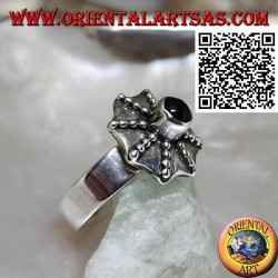 Silver ring in the shape of a pagoda umbrella with a central round onyx