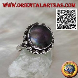 Silver ring with round abalone paua shell surrounded by interweaving and trio of balls