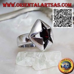 Pentagonal silver pierced ring with oval faceted garnet set in an irregular star