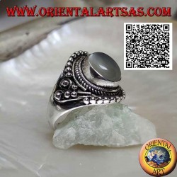 Silver ring with oval moonstone on ethnic setting decorated with intertwining and balls