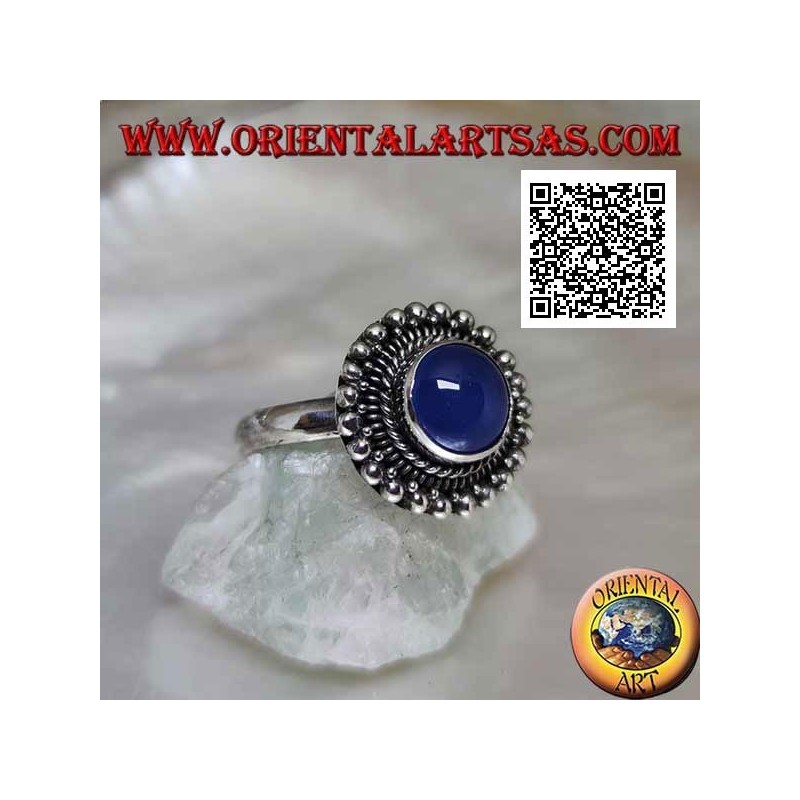 Silver ring with cabochon round blue agate surrounded by interlacing and balls