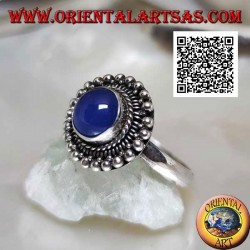 Silver ring with cabochon round blue agate surrounded by interlacing and balls