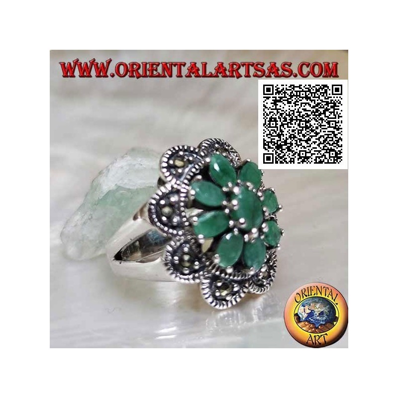 Flower ring in silver with 8 petals of natural emeralds set oval with rounded frame of marcasite