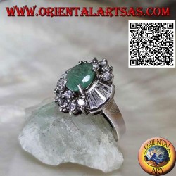 Silver ring with natural oval emerald set surrounded by round and trapezoid zircons