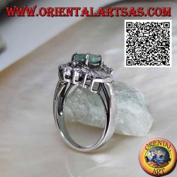 Silver ring with natural oval emerald set surrounded by round and trapezoid zircons