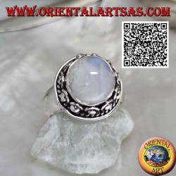 Silver ring with round moonstone surrounded by interweaving and ball in the donut