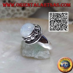 Silver ring with round moonstone surrounded by interweaving and ball in the donut