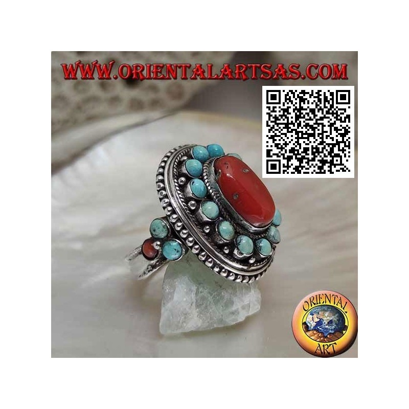 Nepalese style silver ring with natural oval coral and turquoise spheres in the frame and on the sides