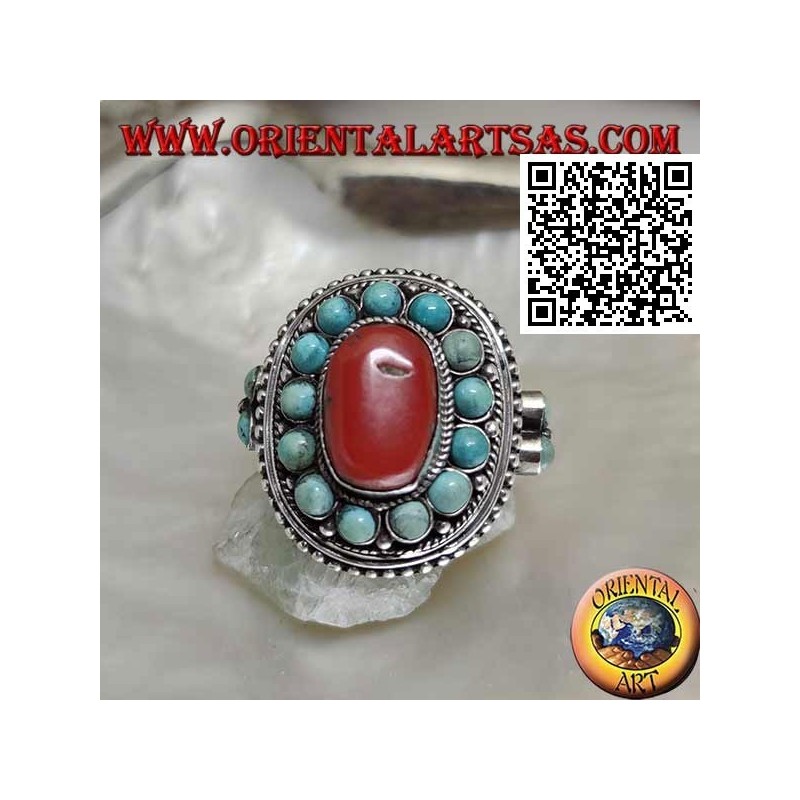 Bague en argent de style népalais avec des sphères ovales naturelles corail et turquoise dans le cadre et sur les côtés