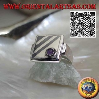 Square silver ring with oblique niello lines and round amethyst in one corner