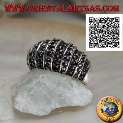 Silver ring with a rounded band on the front cut by vertical lines and studded with marcasite
